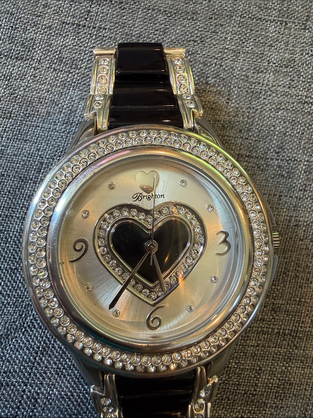 Brighton Carlsbad watch featuring a silver-plated finish, black dial heart motif